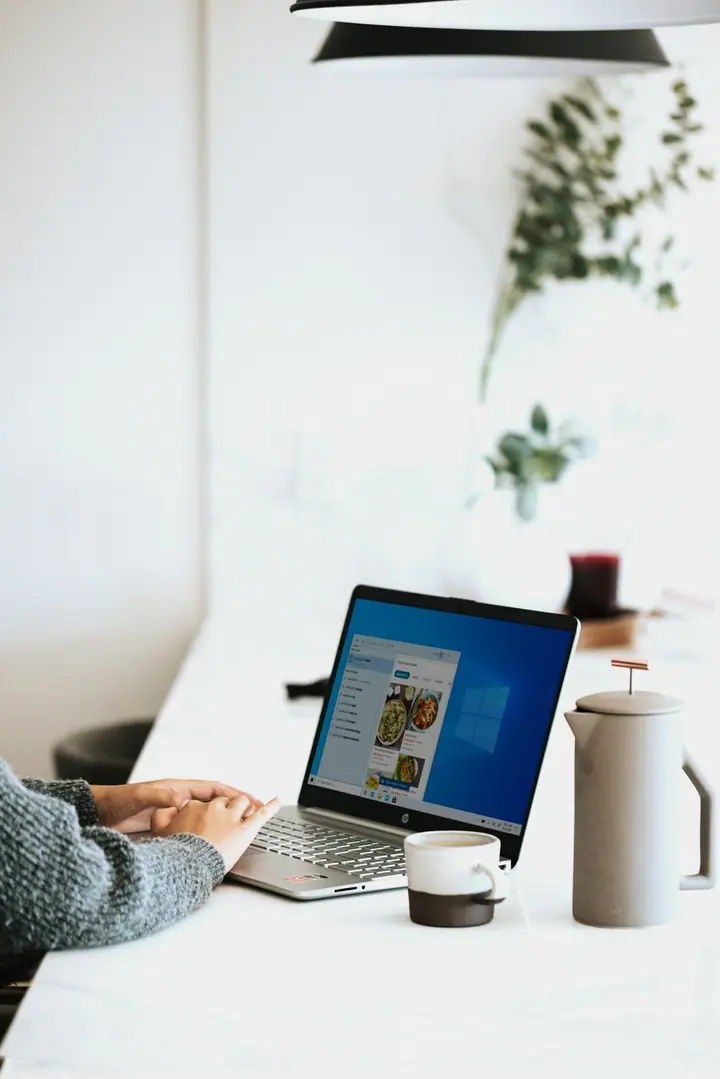 Business user working on a laptop during software workflow planning
